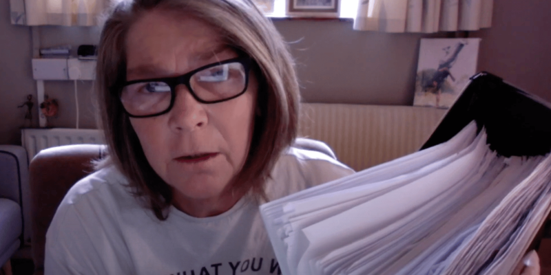 Mum holding a stack of medical records